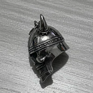 Detail of vintage stainless steel Viking skull bell pendant with horn helmet design