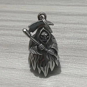 Detailed view of stainless steel Grim Reaper skull bell pendant with scythe on wood background
