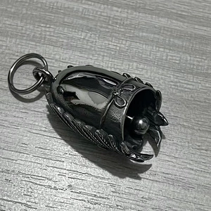 Motorcycle guardian bell pendant with intricate feather relief and gunmetal finish