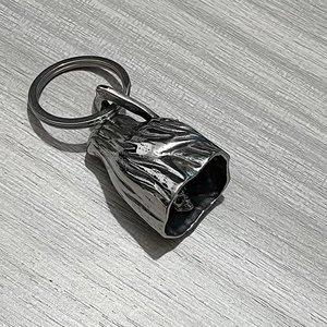 Macro view of gothic reaper bell keychain showing detailed skull clapper and ring