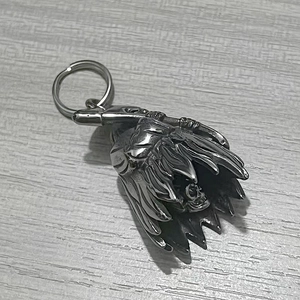 Detailed view of a vintage silver skull pendant with Native American feather headdress motif