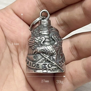 Detailed view of stainless steel eagle bell pendant with Ride to Live engraving and sizing