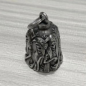 Close-up of vintage stainless steel skull guardian bell with antique finish