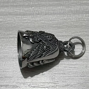 Detailed relief of reaper wings on a stainless steel motorcycle guardian bell