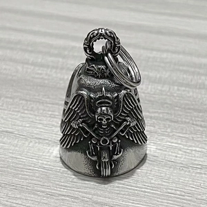 Macro detail of retro guardian bell with wing motorcycle pattern and rustic finish