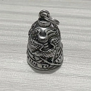 Detailed view of motorcycle ride bell pendant with eagle relief and Ride To Live engraving