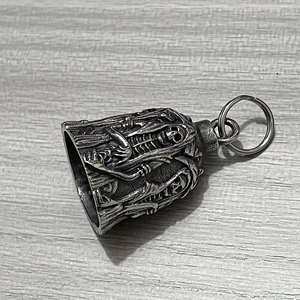 Detailed relief of skull and reaper motifs on a vintage punk style bell pendant