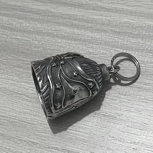 Close-up of vintage stainless steel motorcycle guardian bell with star engraving