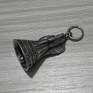 Detail of retro stainless steel guardian angel bell with Angel Watch Over Me engraving