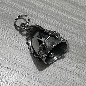 Detailed macro view of vintage guardian bell featuring eagle wing embossed textures