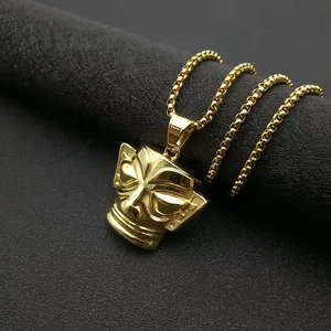 Golden Sanxingdui mask pendant necklace with bead chain on black leather background