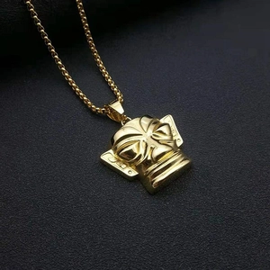 Golden Sanxingdui mask pendant necklace in ethnic style with detailed carvings