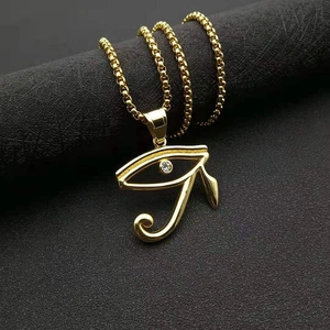 Golden Eye of Horus necklace with cubic zirconia on matte black background
