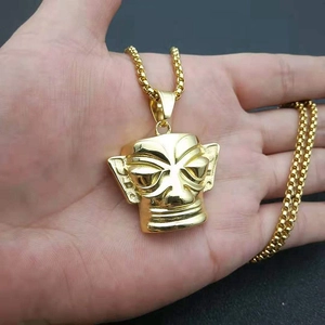 Golden Sanxingdui mask pendant necklace with vintage ethnic design in stainless steel