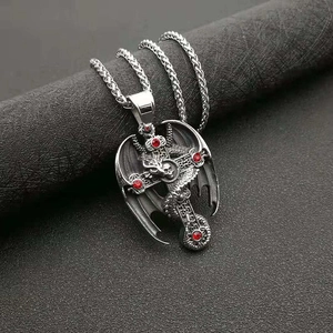 Gothic dragon cross pendant necklace with skull and red gems on a steel rope chain