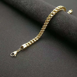 Polished gold-plated Cuban link chain bracelet for men featuring a sturdy lobster clasp