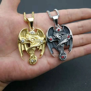 Gothic dragon wing cross pendant necklace in gold and silver with ruby zircon