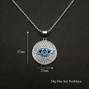 Collier avec pendentif oeil maléfique en acier doré et zircons cubiques avec chaîne box