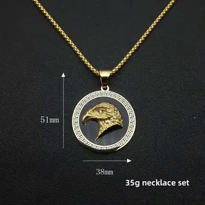 Close-up of golden eagle head relief pendant with greek pattern, 38mm width and 51mm height