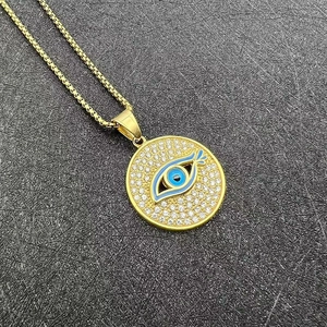 Collier hip hop en acier inoxydable doré avec pendentif œil bleu et cristaux brillants