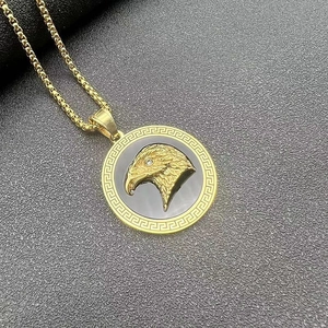 Gold-plated eagle head pendant necklace with rhinestones and Greek meander pattern border