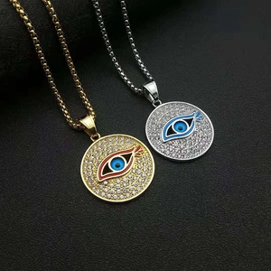 Collier médaillon œil porte-bonheur en or et argent serti de zircons brillants