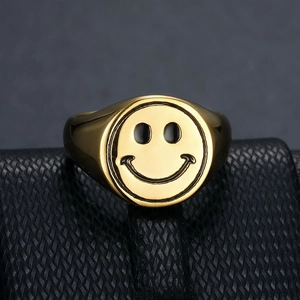 Polished gold-plated stainless steel signet ring featuring a classic smiley face design