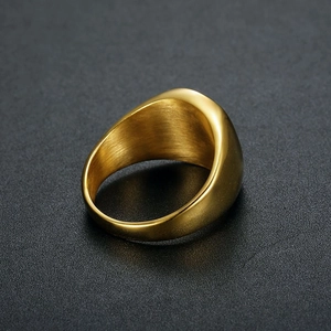 Macro shot of gold-plated stainless steel ring with polished outer and brushed inner finish