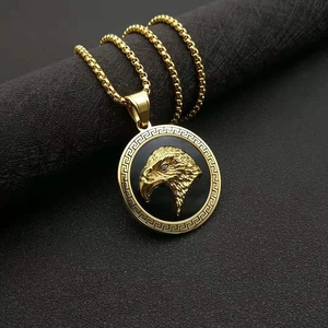 Men's gold-plated eagle head medallion necklace with Greek fret pattern on box chain