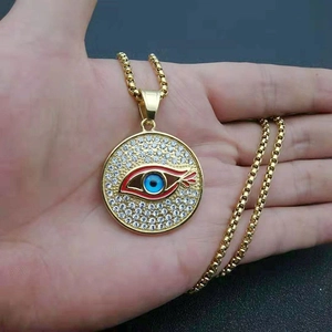 Collier en acier inoxydable doré avec pendentif œil bleu et cristaux brillants
