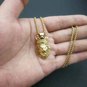 Hip hop lion head necklace with crown pendant in gold finish and sparkling rhinestones