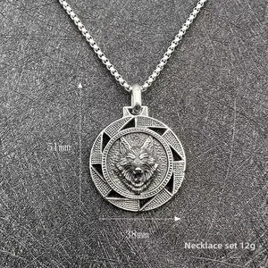Detailed macro of a vintage Viking wolf head pendant with geometric spiral patterns