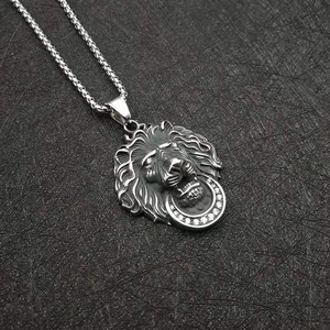 Polished stainless steel lion head pendant necklace with sparkling crystal ring on a box chain