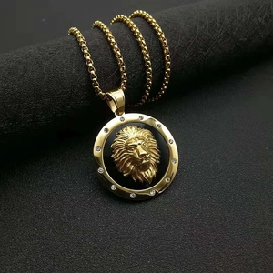 Macro view of gold lion head pendant with sparkling rhinestones and hip-hop design