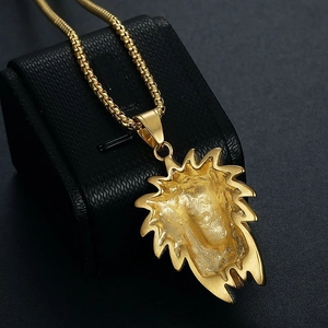 Hip-hop style gold-plated lion head pendant necklace on a black leather jewelry display