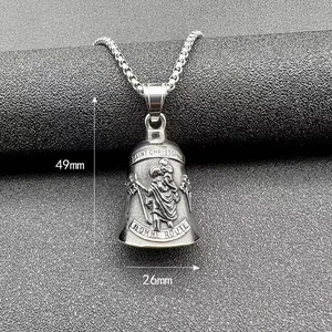 Macro shot of Saint Christopher guardian bell pendant with vintage stainless steel finish
