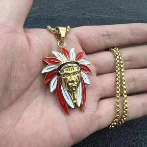Detailed close-up of a gold-plated Indian chief pendant necklace with colorful enamel