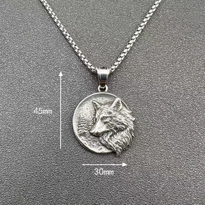 Detail of vintage silver wolf pendant with 30mm diameter and silver box chain necklace