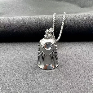 Detailed relief of Saint Christopher lucky riding bell pendant in vintage stainless steel