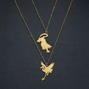Gold plated stainless steel necklace featuring tiger and crane pendants on O-shaped chains