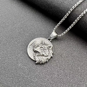 Detail of vintage Viking wolf pendant with embossed forest background and steel square chain