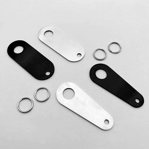 Close-up of black and silver brushed stainless steel motorcycle bell mounting plates
