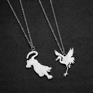 Macro detail of silver stainless steel necklaces featuring tiger and crane pendants
