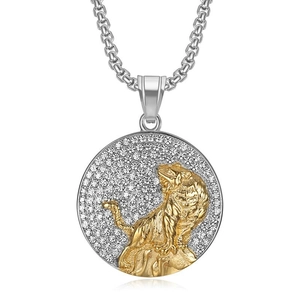 Detailed close-up of a gold tiger head relief on a pavé-set rhinestone round pendant