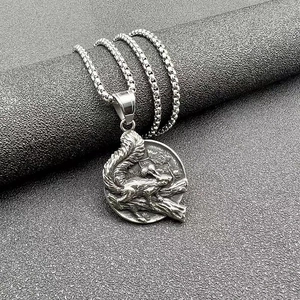 Macro detail of retro squirrel relief pendant with vintage box chain on a textured stand
