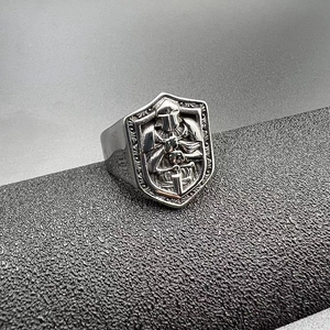 Detailed macro view of retro stainless steel shield ring with medieval knight relief carving