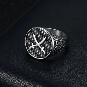 Vintage stainless steel ring for men featuring cross swords emblem on black leather background