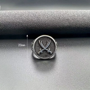 Macro detail of retro stainless steel men ring featuring 20mm crossed sword shield design