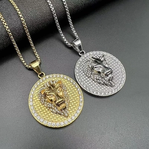 Macro view of hip hop lion head pendants in gold and silver finish with crystal settings