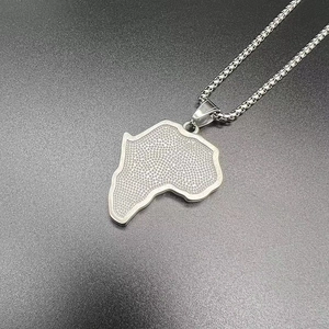 Detailed view of silver Africa map pendant with honeycomb texture on a steel chain
